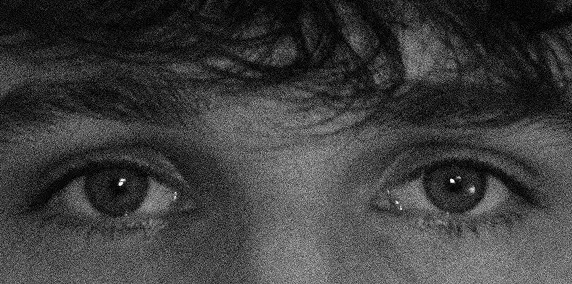 Photoshopped image of a face in a grainy black and white.
