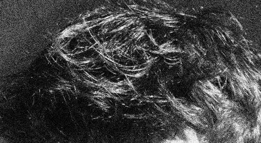 Photoshopped image of a face in a grainy black and white.