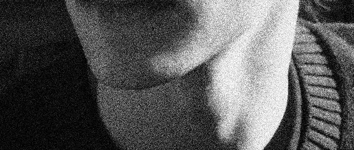 Photoshopped image of a face in a grainy black and white.