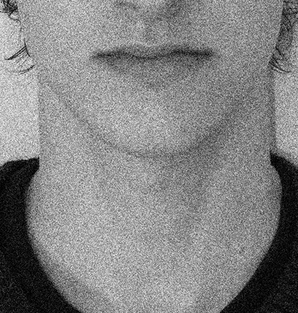 Photoshopped image of a face in a grainy black and white.