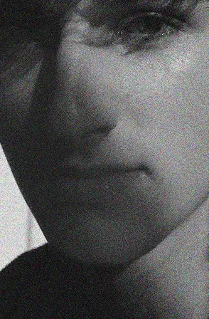 Photoshopped image of a face in a grainy black and white.